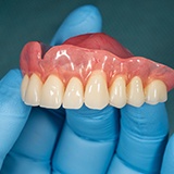 A closeup of a removable upper denture