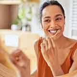 Dentist and couple talking in dental office