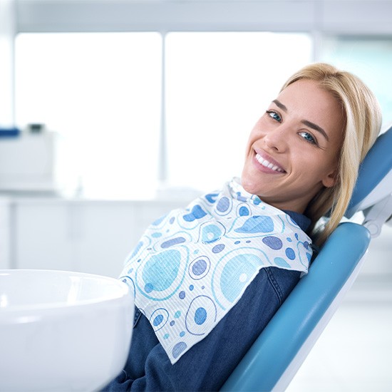 Smiling woman sitting in dental office