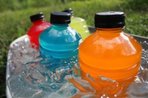 a group of colorful drinks in ice