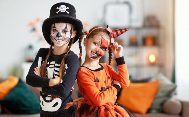 two girls wearing face paint