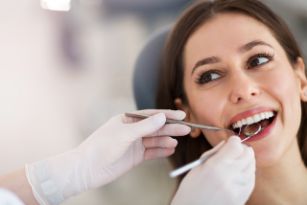 a woman getting her teeth checked