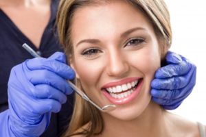 Women smiling during her treatment of teeth