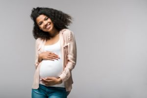 a pregnant woman smiling