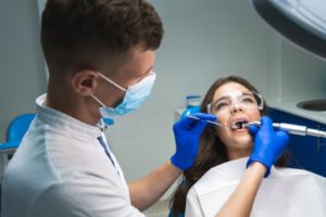 a dentist treating a patient