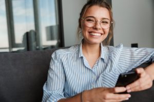 a girl in blue shirt smiling