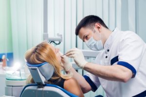 a dentist treating a patient