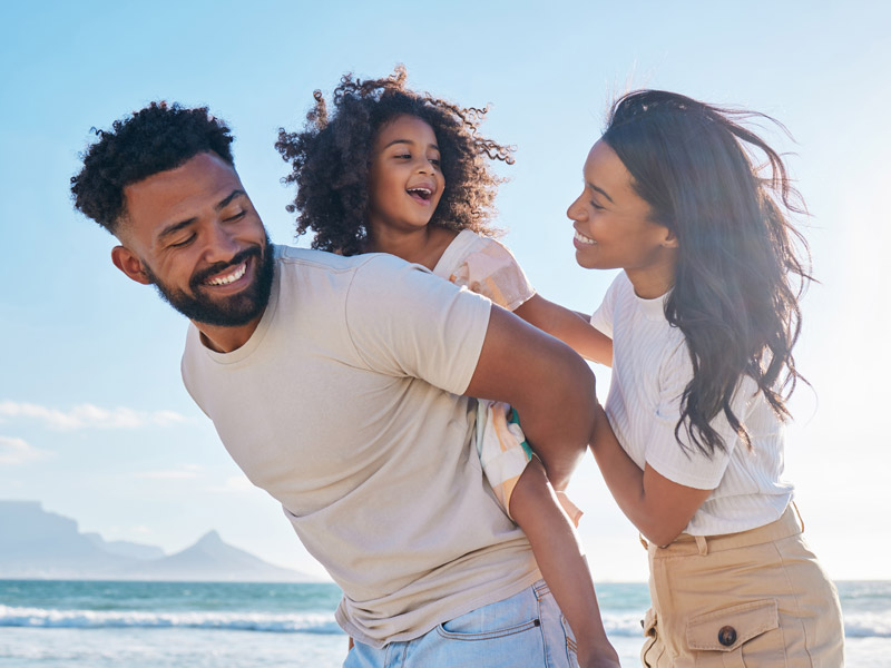 family of three enjoying time together outside