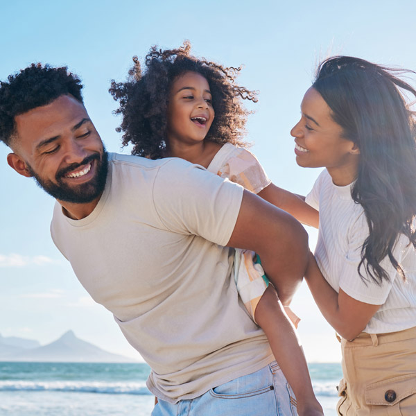 family of three enjoying time together outside