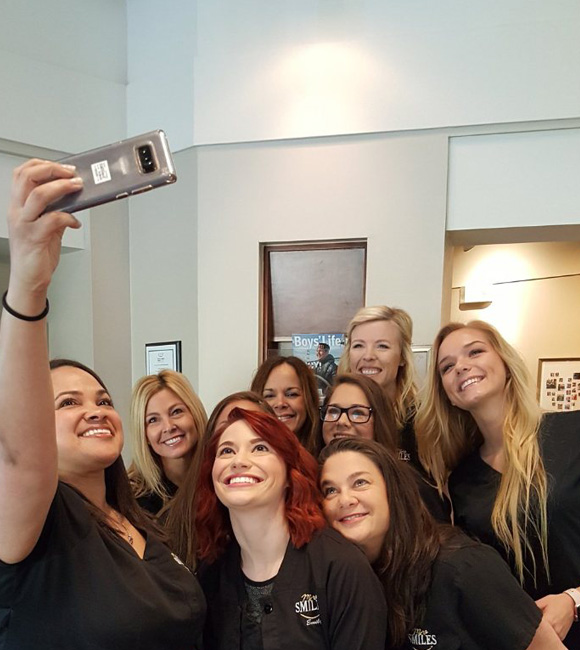 moreSMILES staff taking a selfie together